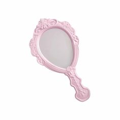 a pink vanity mirror sitting on top of a white wall