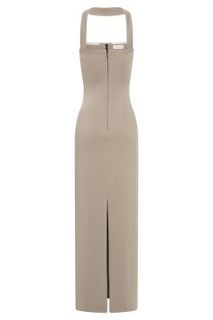 a beige dress with a slit on the side