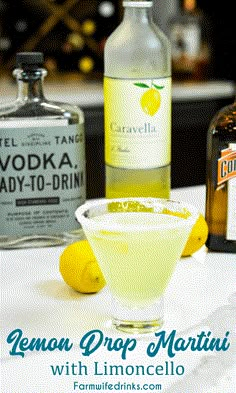 lemon drop martini with limooncello and vodka bottles in the backgroud