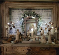 a group of figurines sitting on top of a wooden table next to a mirror