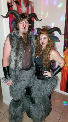 a man and woman dressed up in costumes