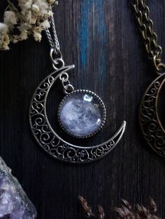 "Witchy moon necklace with your choice of silver or bronze finish, as well as your choice of length. ➳ Moon measures approximately 2\"x2\". ➳ Reference photo chart to determine the length that suits you. ➳ Bronze chain is lead free metal alloy. ➳ Silver chain is stainless steel and suitable for those with allergies to certain metals. ̩̩͙✩*̩̩͙*˚＊ ̩̩͙✩*̩̩͙*˚＊ ̩̩͙✩*̩̩͙*˚＊ ̩̩͙✩*̩̩͙*˚＊ ̩̩͙✩*̩̩͙*˚＊ ̩̩͙✩*̩̩͙*˚＊ ̩̩͙✩*̩̩͙*˚＊ 🌙 The Lunarly Lotus is a new shop but I have been a seller on Etsy for 5 years. Magical Moon Phase Necklace, Magical Moon Phase Jewelry, Mystical Moon Phase Necklace, Mystical Moon Phase Moon-shaped Necklace, Celestial Moon-shaped Metal Necklaces, Celestial Moon-shaped Metal Necklace, Celestial Moon Shaped Necklace With Moon Print, Silver Necklace With Moon Charm In Brass, Silver Brass Necklace With Moon Charm