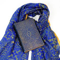 Royal blue is matched with gilt gold to produce an elegant design of detailed line-work. Let others revel at your royal scarf, as you relish the rightful admiration over your fine fashion taste. Inspiration: Poetical Works of Byron, c.1900 Classic Gold Silk Scarf, Traditional Gold Silk Scarves, Classic Gold Silk Scarf For Formal Occasions, Elegant Blue Scarves For Wedding, Elegant Blue Scarf For Wedding, Blue Vintage Shawl Scarf, Blue Vintage Silk Scarf For Formal Occasions, Vintage Blue Silk Scarf For Formal Occasions, Elegant Blue Shawl Scarves