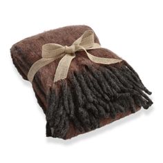 a brown and black blanket with a bow on it