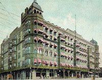 an old photo of a large building with many windows