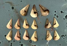 Set of 15 polished lacquered brass folded triangle stampings. Large (3) 40 mm L x 23 mm W x 12 mm D (4) 30 mm L x 18 mm W x 10 mm D (8) 30 mm L x 18 mm W x 10 mm D  45 gram set Some may show slight signs of oxidation from age, which will need to be polished. Scranton Pa, Polished Brass, Holiday Gifts, Stamp, Brass, Paper Party Supplies, Craft Supplies, Party Supplies, Signs