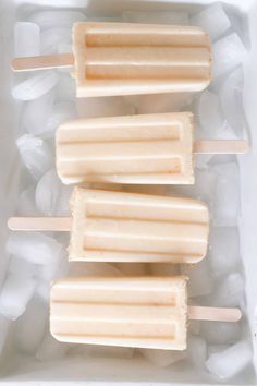 orange creamsice popsicles in an ice tray with text overlay that reads, orange cremesice popsicles