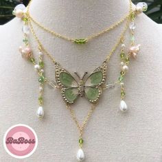 Capture the enchantment of nature with our Cute Fairy Green Butterfly Necklace. This whimsical piece is a delicate blend of charm and elegance, featuring a beautifully crafted green butterfly pendant. The intricate detailing adds a touch of magic to your neckline, making it a perfect accessory for those who appreciate the ethereal beauty of nature. Green Butterfly Charm Necklace, Bohemian Necklace With Butterfly Charm, Elegant Green Butterfly Necklace As Gift, Elegant Green Butterfly Necklace For Gift, Elegant Green Butterfly Necklace Perfect For Gifts, Elegant Green Butterfly Necklace, Green Butterfly Charm Pendant Necklace, Green Butterfly Pendant Necklace, Nature-inspired Butterfly Charm Necklaces