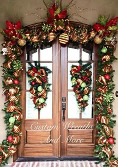 christmas wreaths and decorations decorate the front door