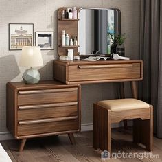 a wooden desk with a mirror, stool and lamp on it next to a window