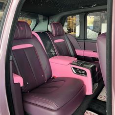 the interior of a pink and black vehicle