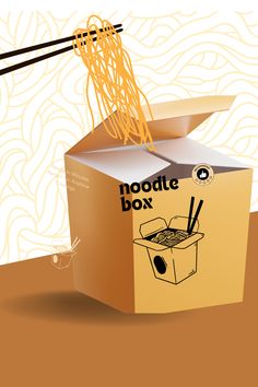 an open box with noodles and chopsticks sticking out of it, on top of a table