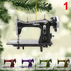 the sewing machine ornament is hanging from a christmas tree with four different colors