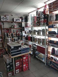 a room filled with lots of different items and shelves full of various types of electronics