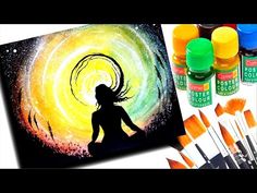 painting with acrylic paint and brushes on the table next to it is an image of a woman