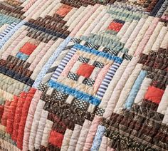 a close up view of a colorful quilt