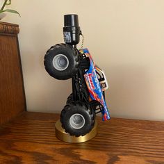 Custom Summit Racing Big Foot, Monster Truck lamp.  It would be perfect for an office, child's themed bedroom, or shop.  It would make a great Father's Day gift or birthday present.  Lamp shade not included due to shipping constraints.  Approximately: 6" wide X 6" long X 10" tall without shade.  Made with all new materials.  The shade size used in the photos is approximately 8" at the widest part of the shade and 7" tall.  1:24 scale.  Die cast metal body and some plastic pieces. Monster Jam Room, Monster Truck Bedroom Decor, Monster Truck Decor, Monster Truck Lamp, Monster Jam Grave Digger, Summit Racing, Traverse City Mi, Themed Bedroom, Traverse City