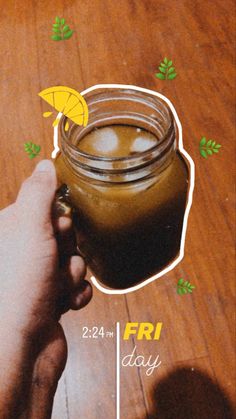 a person is holding a jar with liquid in it on a wooden table next to an advertisement for fri day