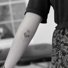 a person with a tattoo on their arm