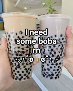 two people holding up cups with the words i need some boba in each cup