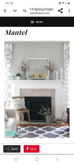 a living room with fireplace, chairs and flowers in vases on the mantel