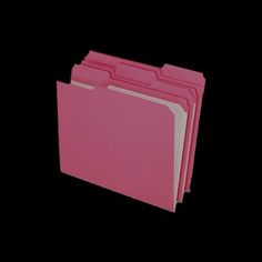 pink file folders stacked on top of each other in front of a black background