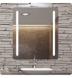 a bathroom sink sitting under a mirror in front of a stone wall