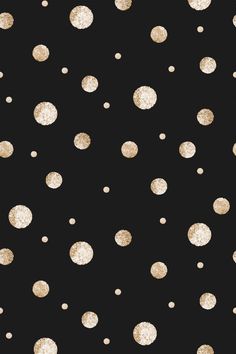 black and gold polka dot wallpaper with white dots on the bottom, in different sizes