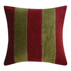 a red and green striped pillow on a white background