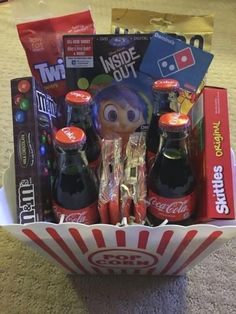 a basket filled with sodas and snacks