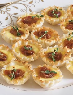 small appetizers are arranged on a white plate