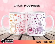 two coffee mugs with different designs on them