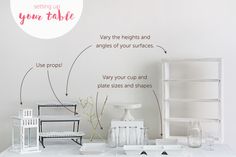 a white table topped with vases and other items next to a wall that says, setting up your table