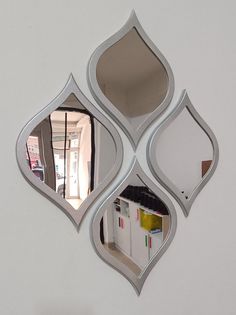 a mirror that is on the side of a wall