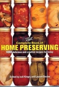 the complete book of home preserver is shown in front of a box with jars full of pickles