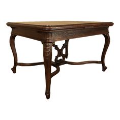 an antique wooden table with carved legs and a leather top on the bottom, isolated against a white background