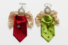 two ties with bows and bells hanging from the side, one red and one green