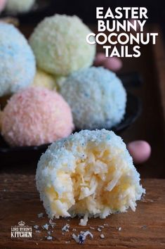 a close up of some kind of dessert on a plate with coconut and powdered sugar