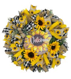 a sunflower wreath with the word welcome on it and some black and white checkered ribbon