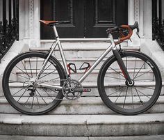 a bicycle parked on the steps of a building