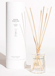 reed diffuser next to box with white packaging