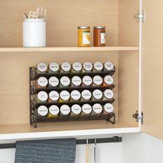 the spice rack is full of spices and jars