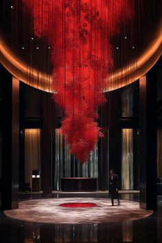 a large red sculpture hanging from the ceiling