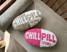 two pink and white slippers sitting on top of a table next to each other