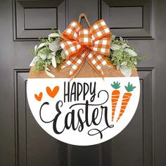 a happy easter door hanger with carrots and succulents on it