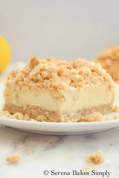 a slice of lemon crumb cake on a white plate