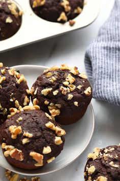 chocolate muffins with walnuts on a plate