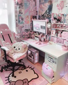 a pink hello kitty themed room with lots of toys and decorations on the walls, including a computer desk