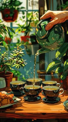 a person pours tea into cups on a table with potted plants in the background