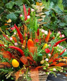 a basket filled with lots of different types of flowers